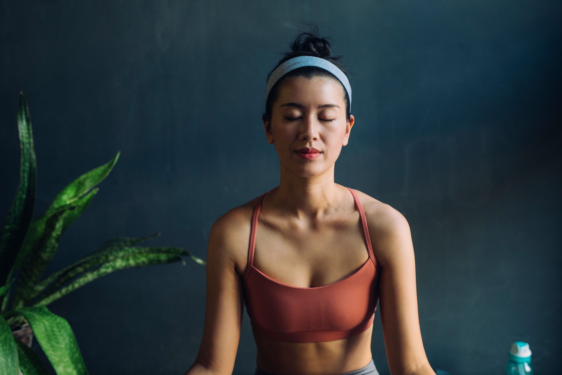 Portrait of a Beautiful Asian Woman Meditating with her Eyes Closed